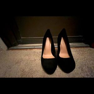 Black suede pumps